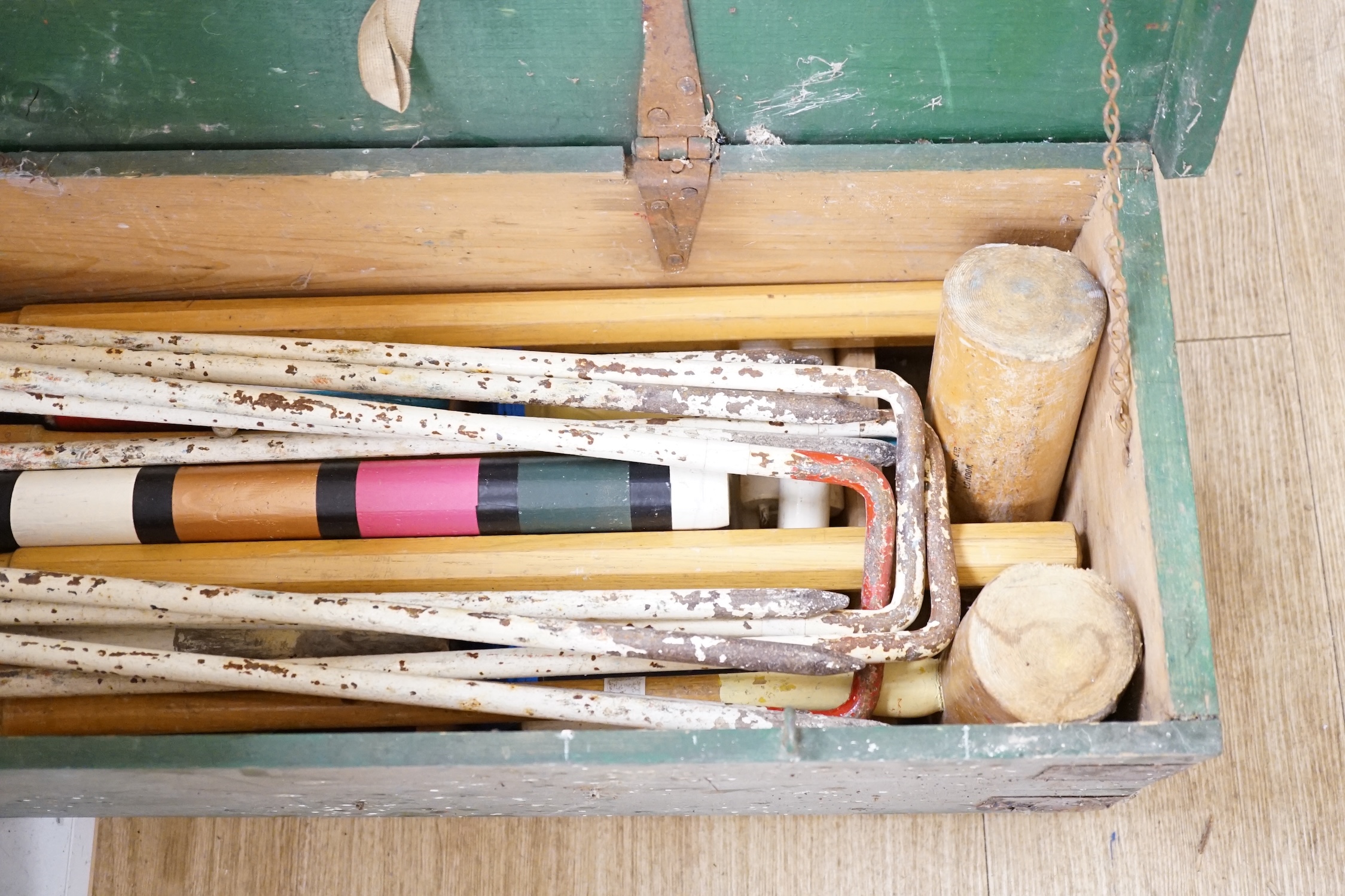 An early 20th century boxed croquet set